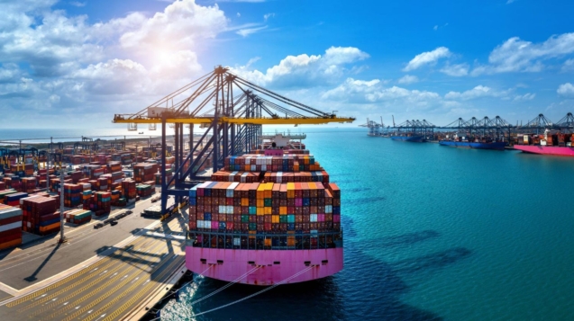 Cargo ship loaded with containers at a Dubai shipping company port. Global trade and logistics.